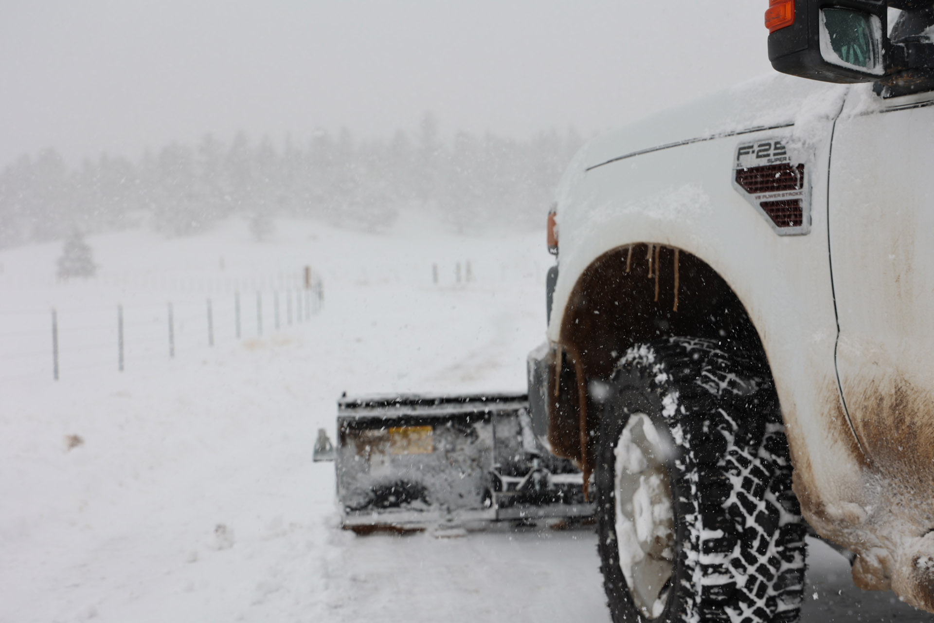 snow removal example showing truck with snow plow 